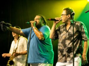 Photo of two singers and one guitar player from the Marsels