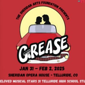 Grease poster with silhouette of couple sitting in a red car