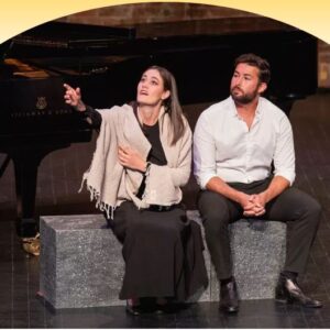 Woman and man onstage for opera performance