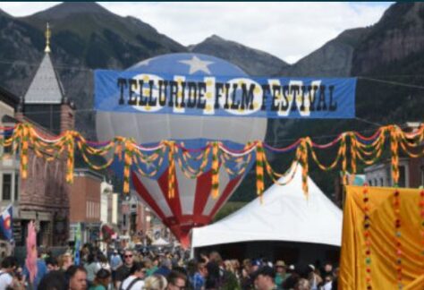 Photo of crowds in downtown Telluride enjoying the festival